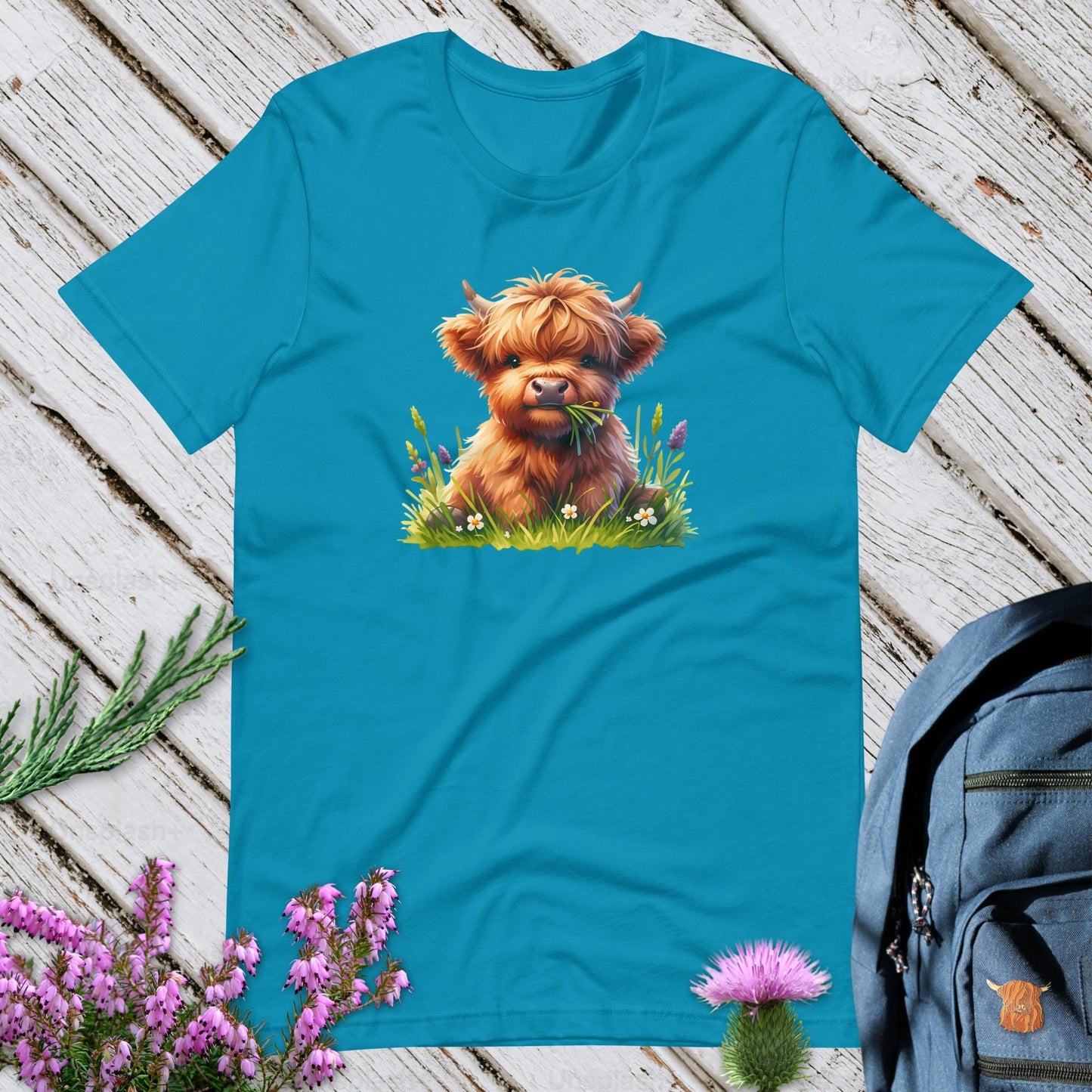 A Highland Cow In The Grass Unisex T-Shirt
