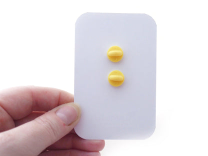 2 Rubber Clutches on the back of a Backing Card